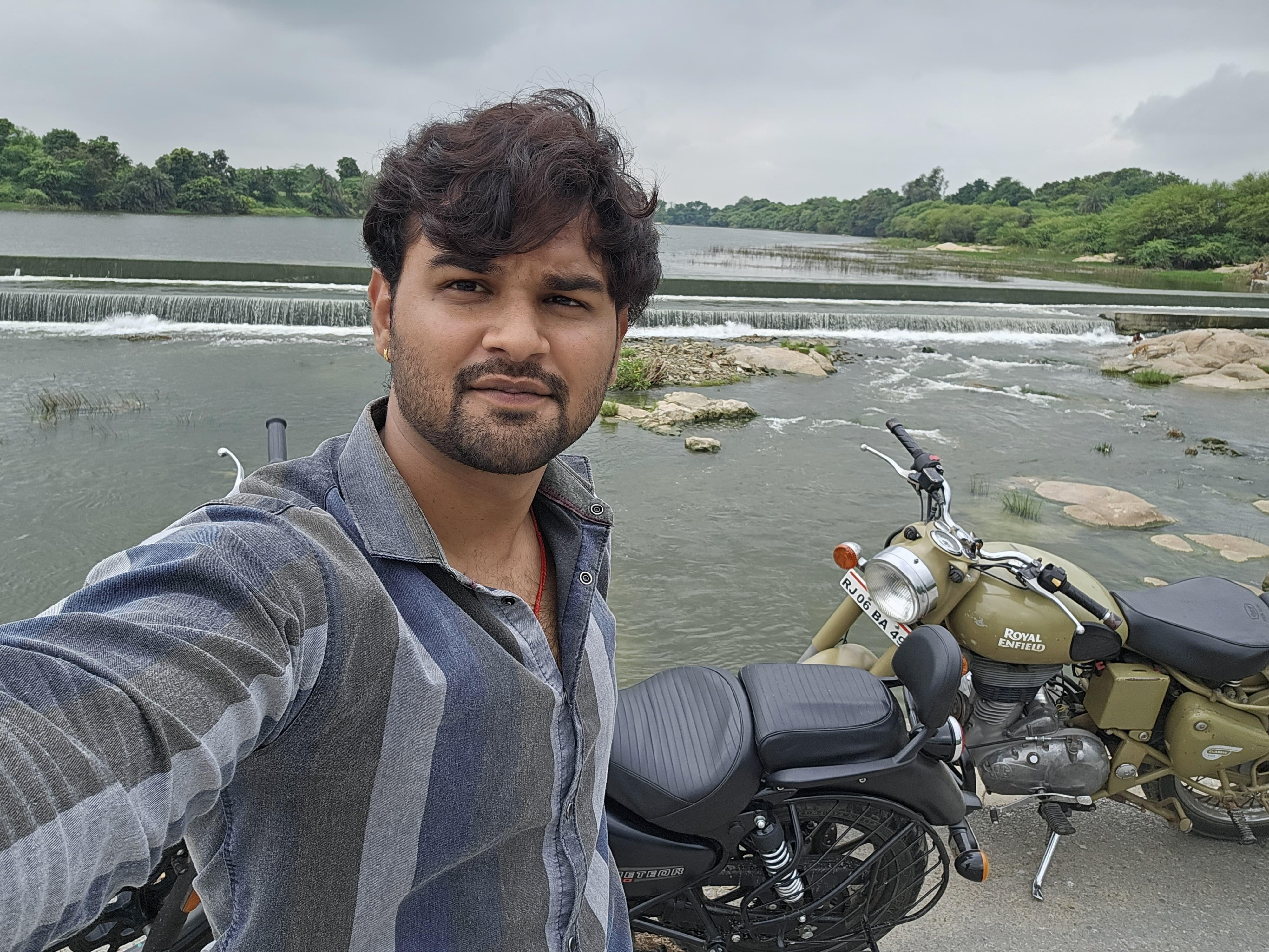 Prince Choudhary selfie with Royal Enfield bikes by the river