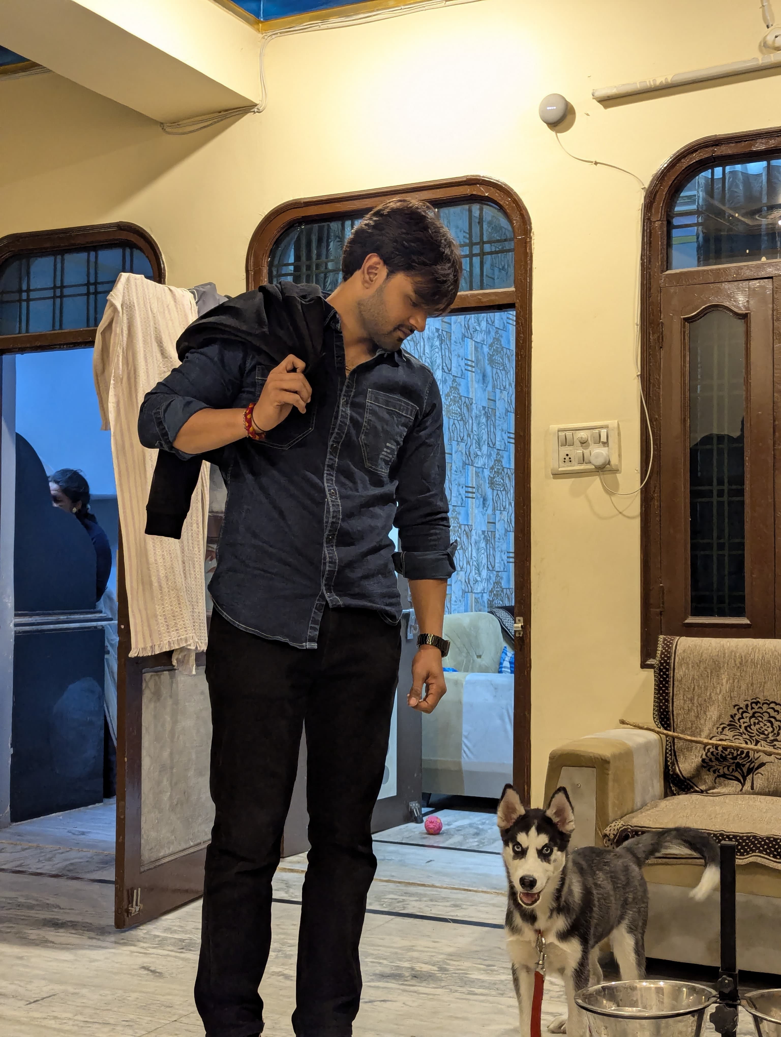 Prince Choudhary indoors with his Husky